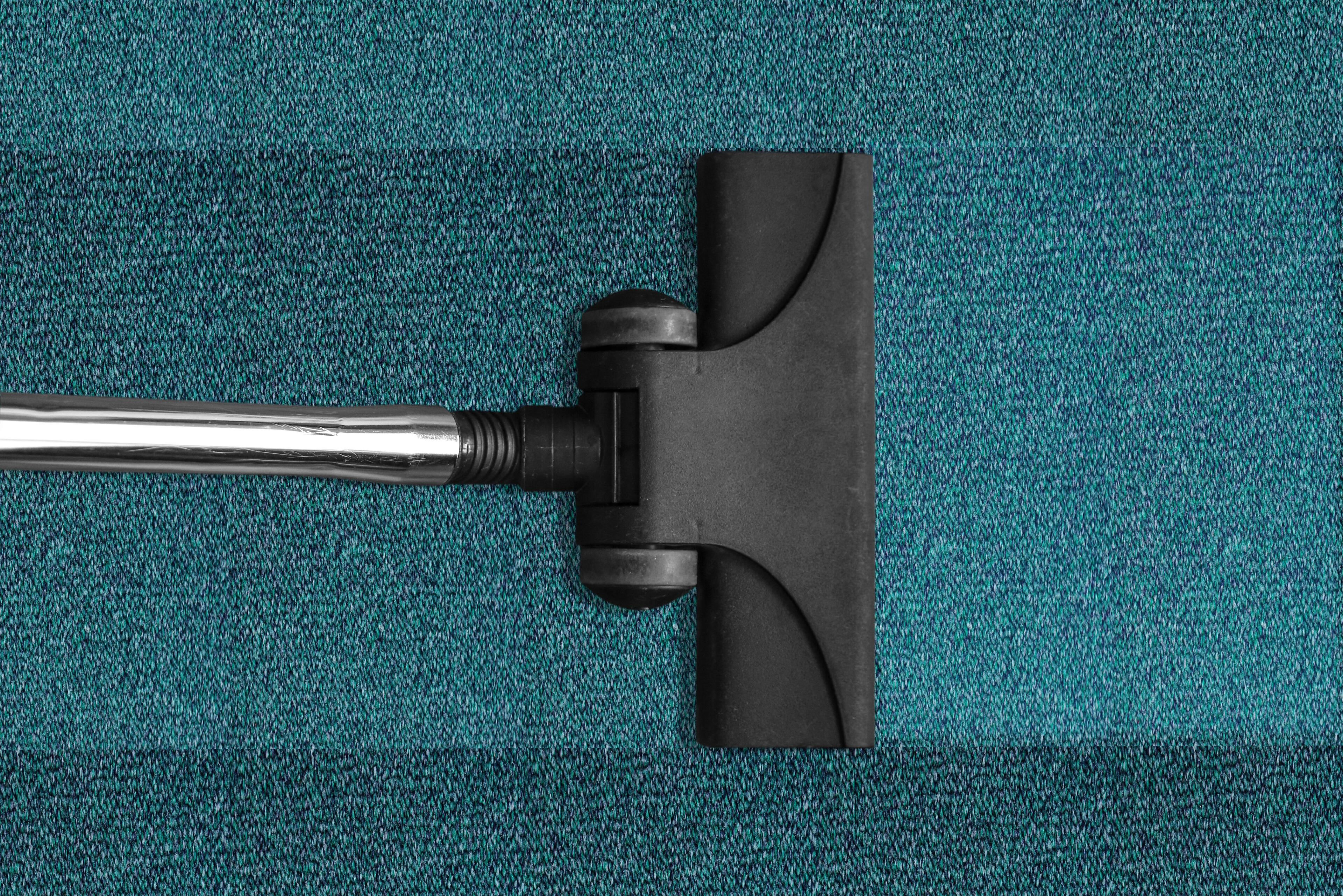 Detail-Oriented Cleaning Vacuum cleaner thoroughly cleaning carpet with attention to detail.